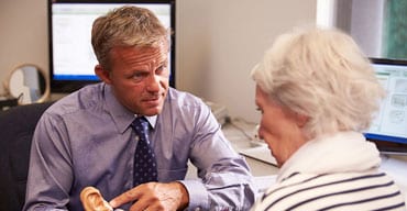 A man and woman are talking to each other.